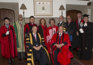 Members of the procession pose for a group photo ahead of the convocation ceremony at Trinity College.