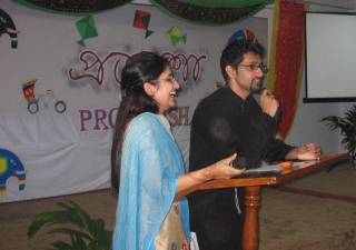 Noman Nasrullah, the lead camp cordinator and Beenisha Enayatali, a participant and Master of Ceremonies for the campfire night, sharing a light moment.   