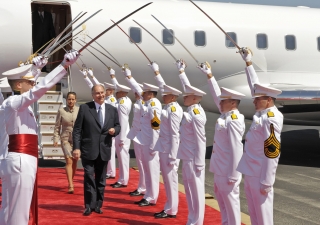 Mawlana Hazar Imam and Princess Zahra walk under a sabre arch salute presented by the Sol Ross volunteers of Texas, as they disembark in Austin, USA. 