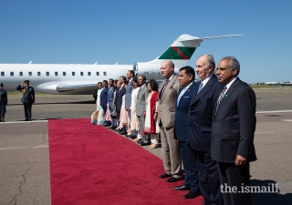 Mawlana Hazar Imam, Prince Amyn, Lord Ahmad, and leaders of the Jamat observe the Nashid al-Imamah and the British National Anthem.