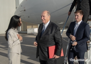 Mawlana Hazar Imam arrives in Calgary with Prince Aly Muhammad following the inauguration of the Aga Khan Garden, Alberta earlier in the day. He was received by Ismaili Council for the Prairies President Fauzia Lalani upon his arrival.