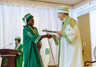 An AKU graduand in Dar es Salaam receives her degree from Mawlana Hazar Imam, the Chancellor of the Aga Khan University. AKDN / Aly Ramji