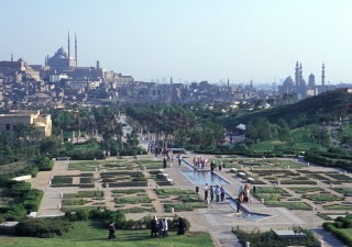 Al-Azhar park in Cairo features walkways, fountains, lawns, and gardens overlooking a lake in the traditional chahar bagh style.