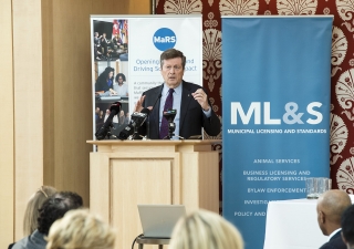 Toronto Mayor John Tory welcomes attendees to the &quot;Sharing Economy&quot; forum held at the Ismaili Centre. Moez Visram