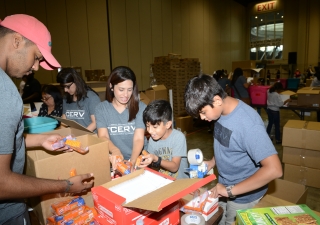 Younger members of the Jamat assisting in the HOPE for Puerto Rico event at the Orlando Convention Center.