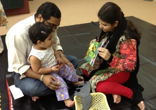 Parents play with their child during a Parwaaz early child development session. Ismaili Council for Pakistan