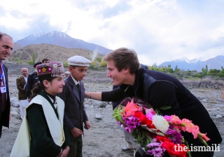 Prince Aly Muhammad is presented a bouquet of flowers upon his arrival in Immit, Ishkoman Punyal, Gilgit-Baltitsan in October 2017.