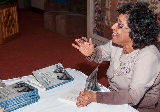 Parin Dossa signing her books at the Ismaili Centre in Vancouver. Sultan Baloo