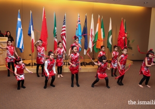 The Girl Scouts perform traditional dances representing their assigned country.