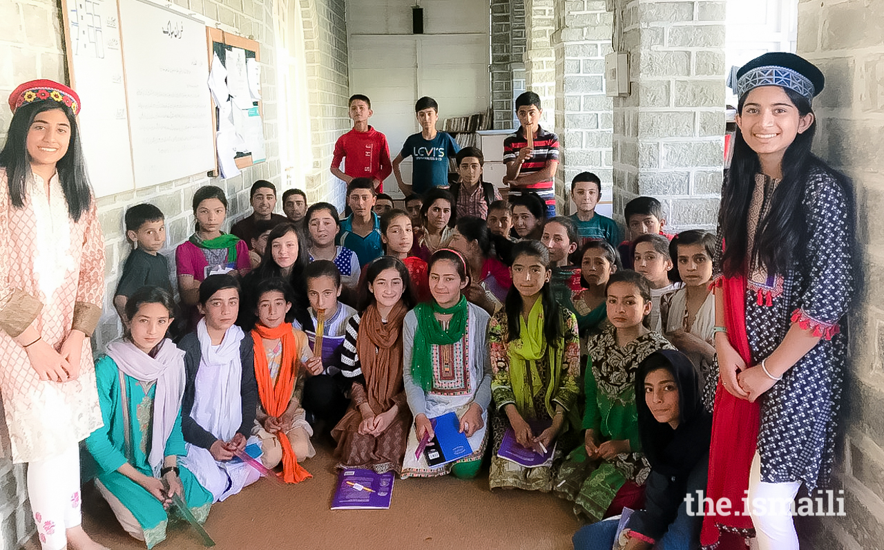 Insha and her cousin, Arysha,with some of their students outside Karimabad Jamatkhana in Hunza.