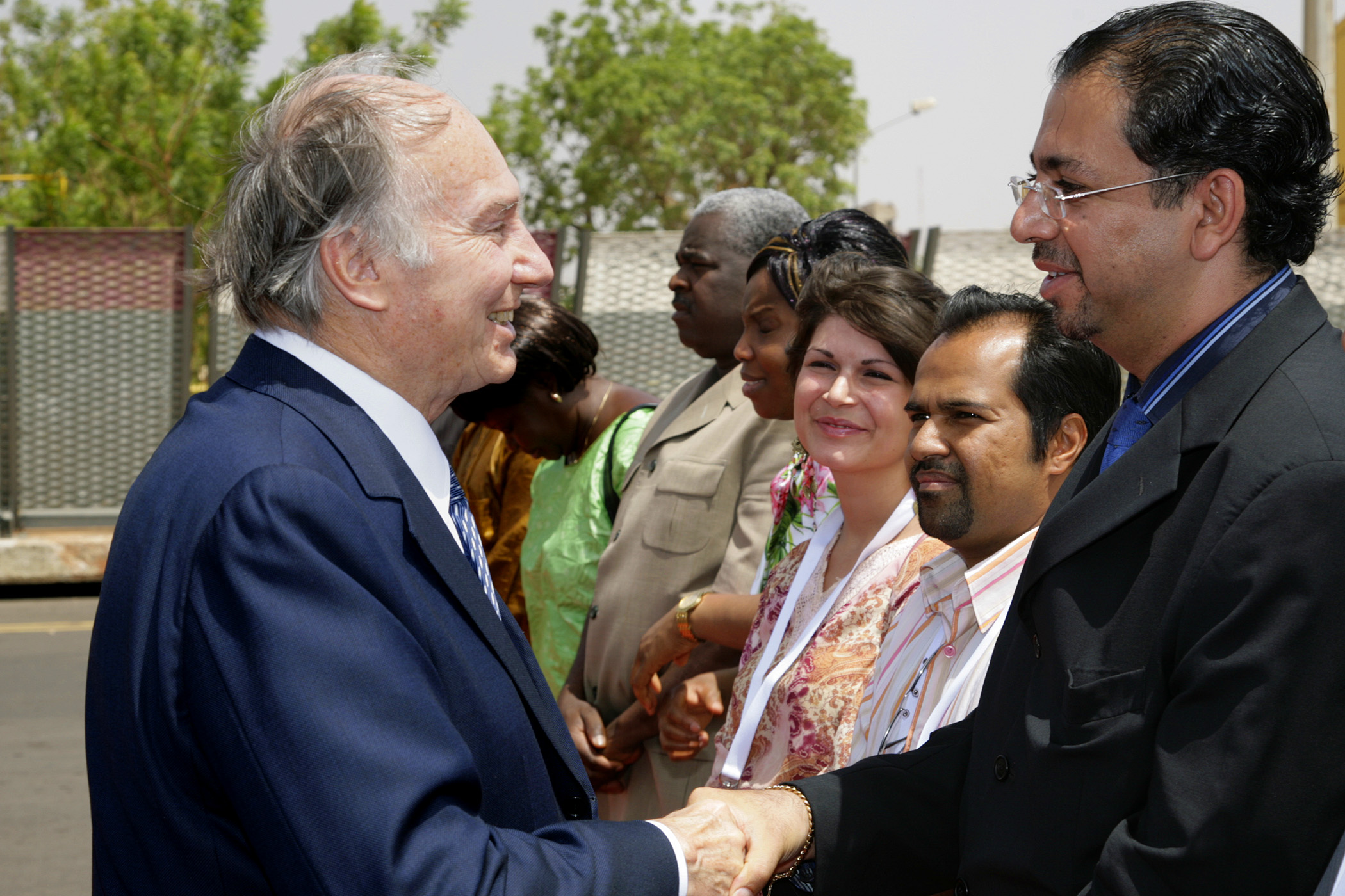 Mawlana Hazar Imam spends a moment with AKDN staff and volunteers from the Jamat of Burkina Faso, prior to departing the country. Photo: Arnhel de Serra