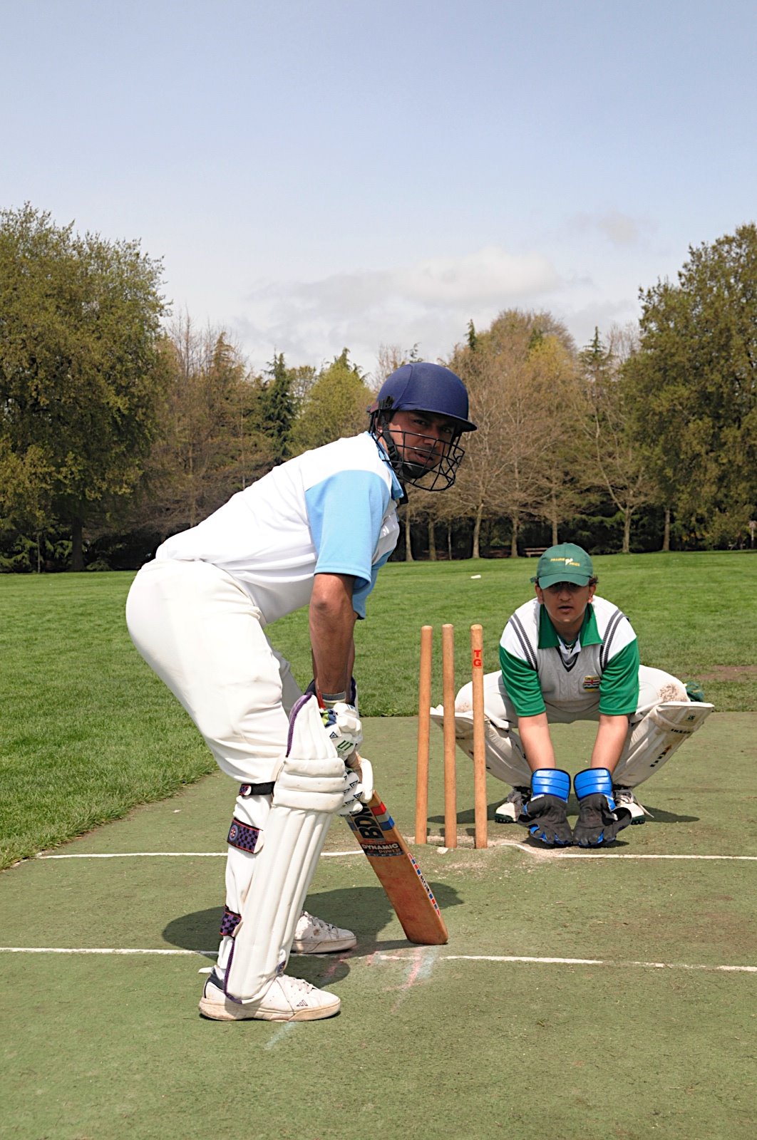 A cricket batsman and wicketkeeper take their positons. Photo: Moez Visram