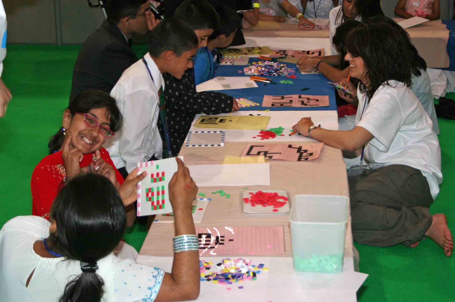 Children participate in creative activities such as tasbih-making and face painting. Photo: Courtesy of the Ismaili Council for the UK