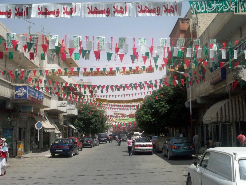 Ass'en Street in Salamieh decorated in green, red and golden colours to welcome Mawlana Hazar Imam. Photo: Yamen Mahmoud Farha