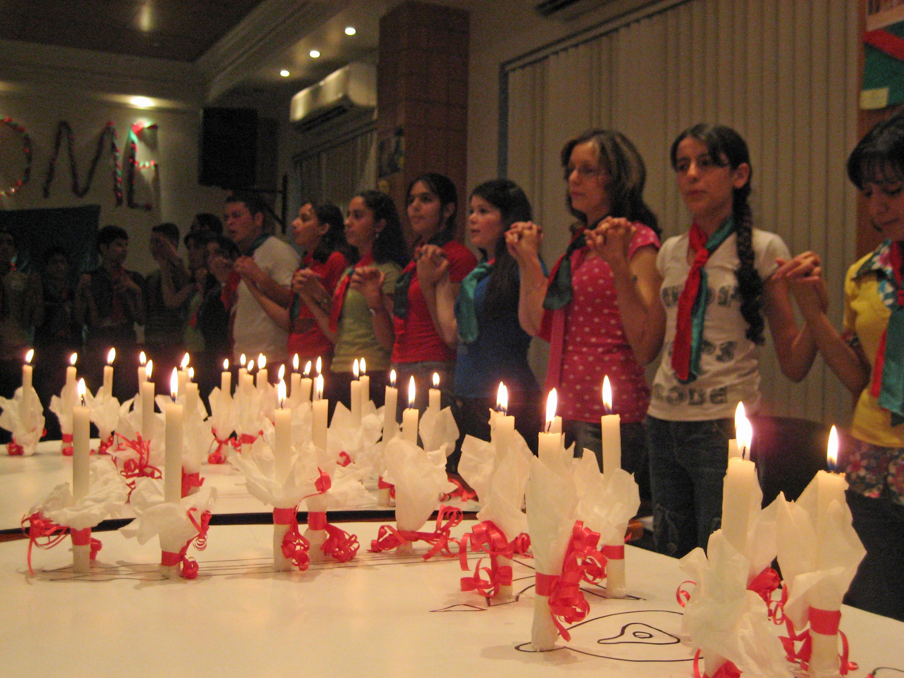 Youth in Damascus offer Golden Jubilee wishes as they light candles and place them in a formation that spells “Golden Jubilee” in Arabic. Photo: Courtesy of Ismaili Council for Syria