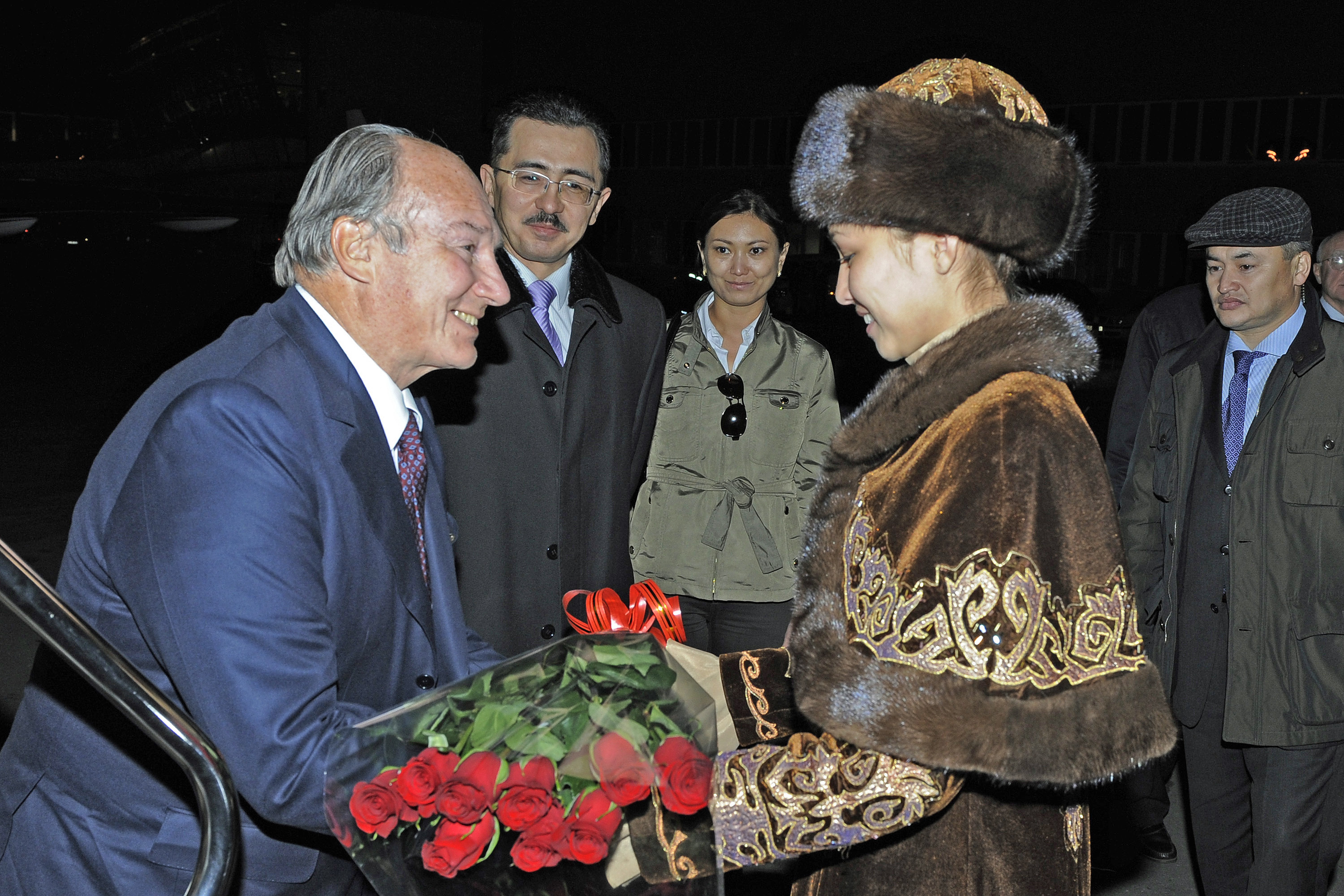 Arriving in Astana at the start of his Golden Jubilee visit to Kazakhstan, Mawlana Hazar Imam is greeted with a traditional Kazakh welcome as government officials look on. Photo: Gary Otte