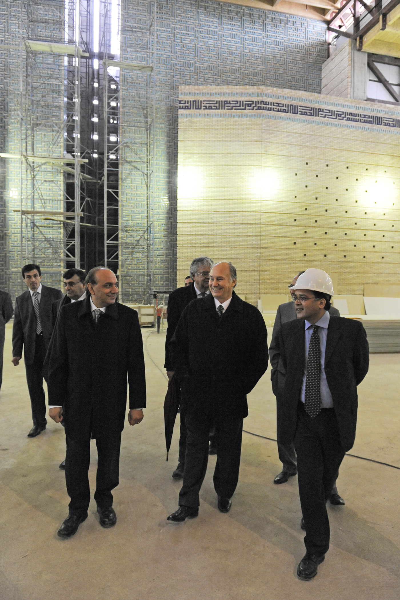 Mawlana Hazar Imam tours the prayer hall of the soon to be completed Ismaili Centre Dushanbe. He is accompanied by the building's Chief Architect and the Project Manager. Photo: Gary Otte