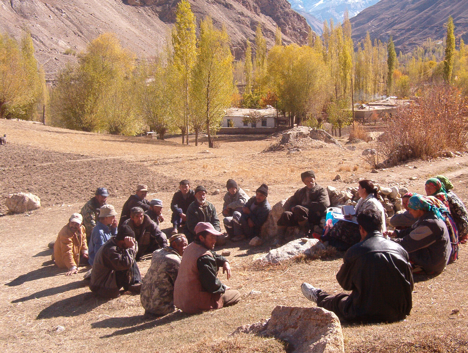 A FOCUS Community Mobiliser meets with community members in the Roshqala district in 2004, to discuss the results of a hazard and vulnerability assessment. Photo: Courtesy of FOCUS