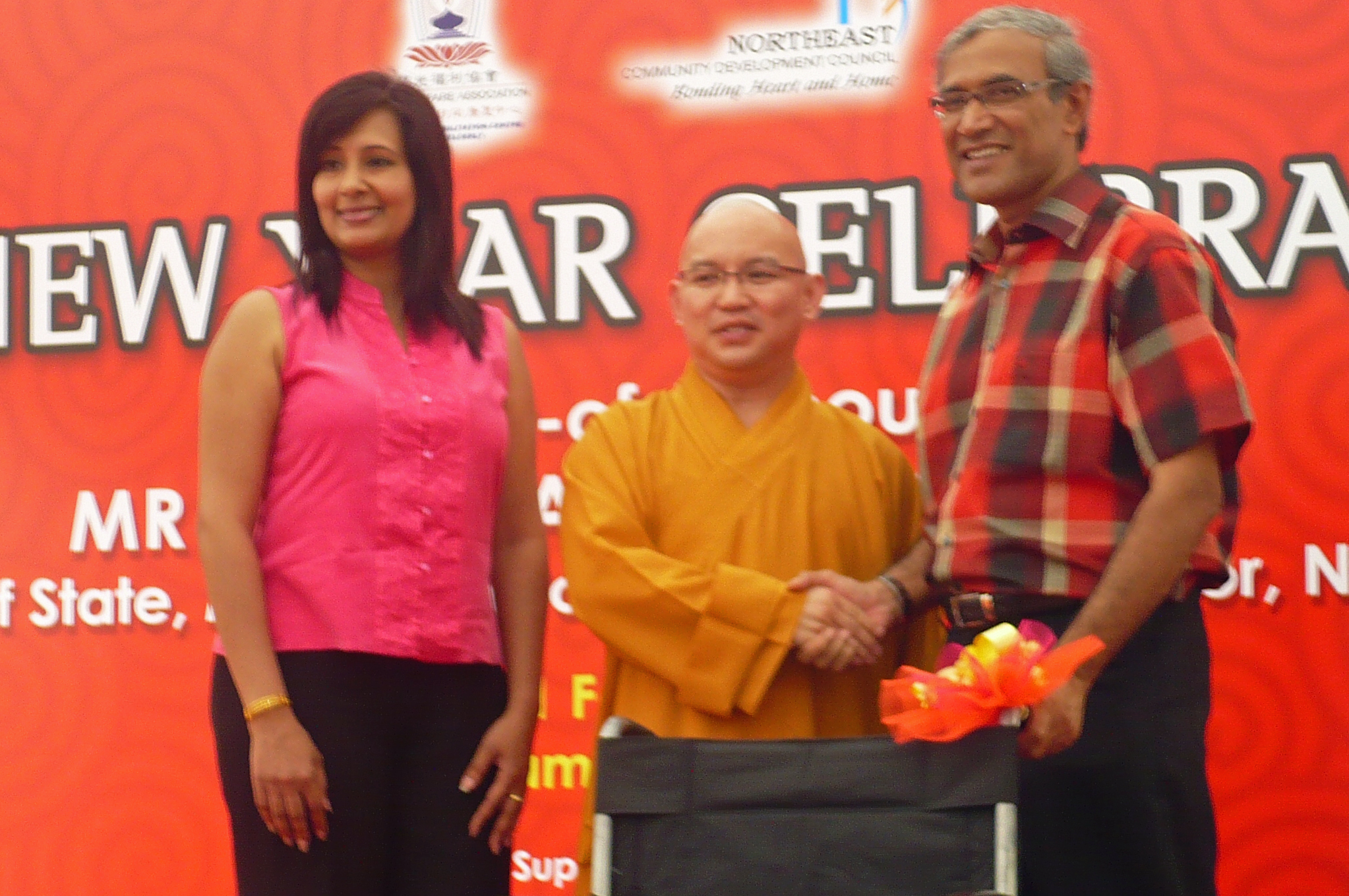 His Excellency Zainul Abidin Rasheed and Presidentbanoo Karam Bana present a wheelchair to a social welfare group representative. Photo: Haneesa Habib