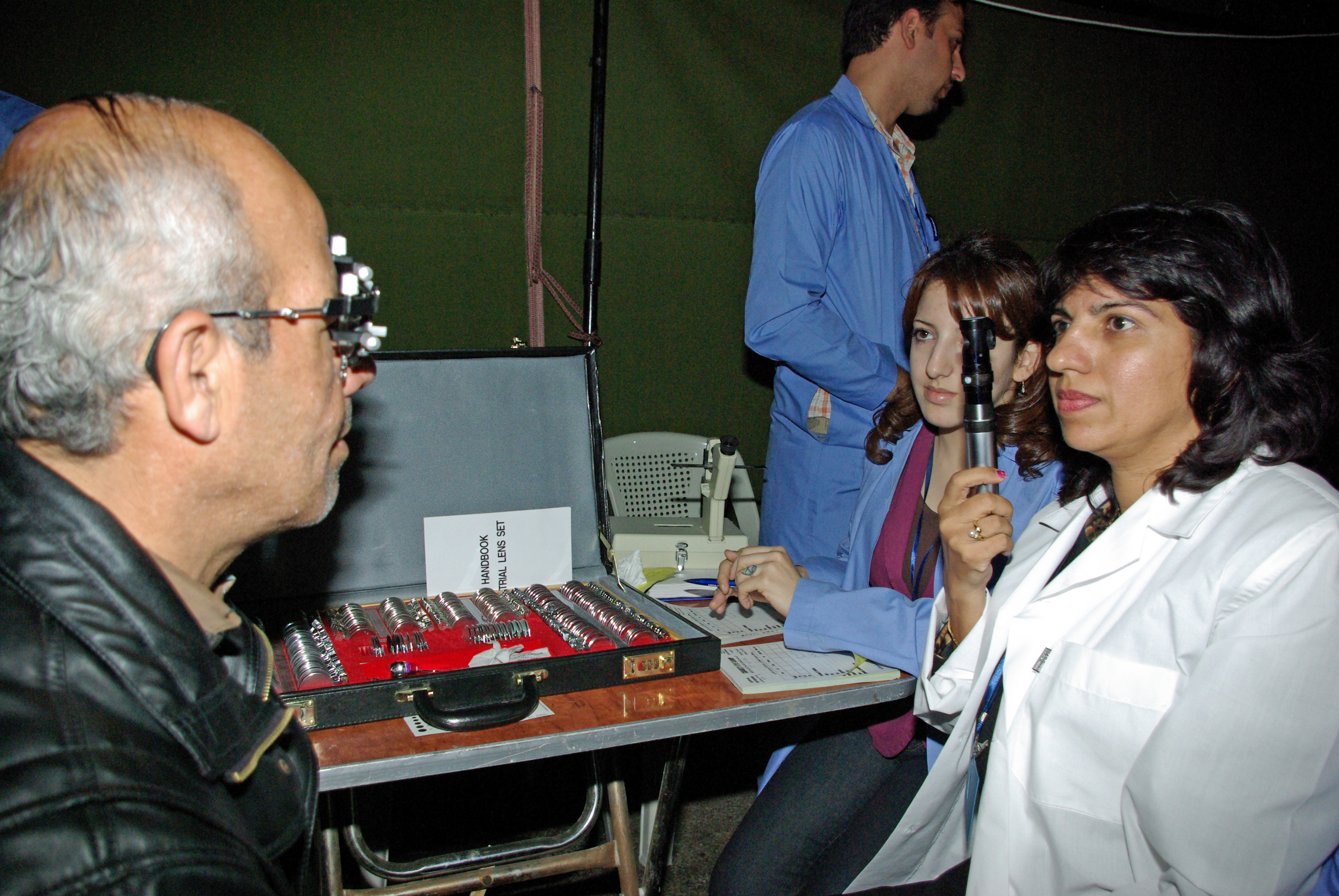 Dr Soroya Janmohamed attends to a patient at the eye camp in Syria. Photo: Zahir Daya