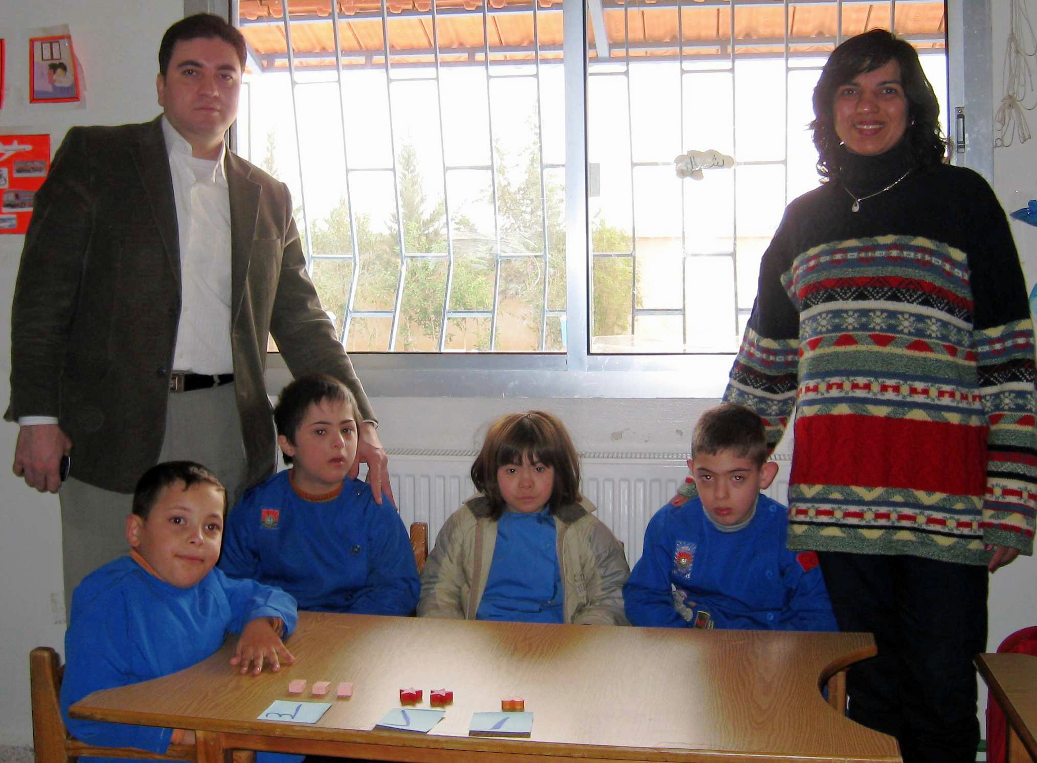 Dr Janmohamed and Dr Alhamwi, an Ismaili ophthalmologist from Syria, visit children at a school for disabled children in Salamieh. Photo: Zahir Daya