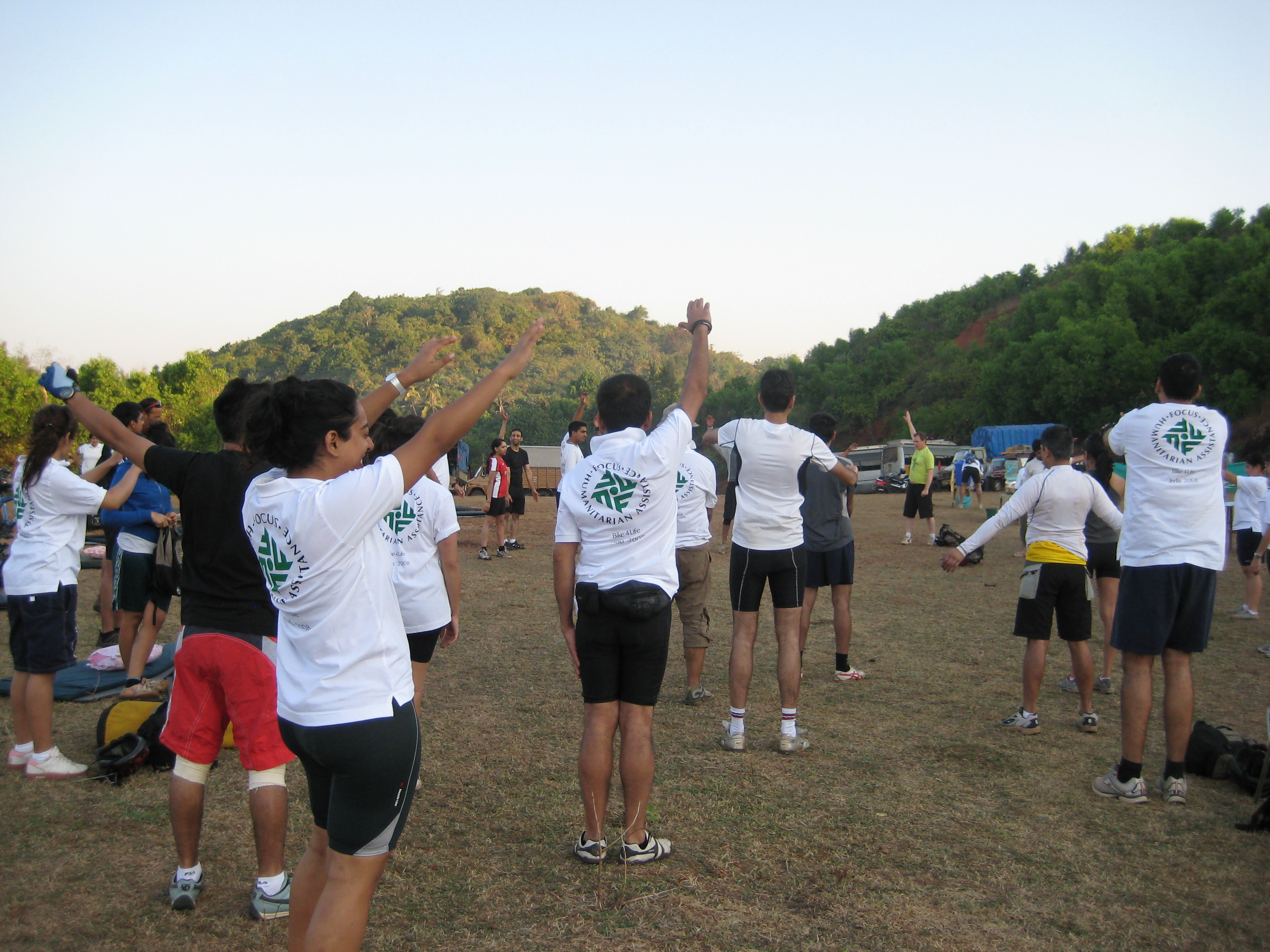 Participants began their day soon after sunrise, with warm-up exercises to get limber ahead of the day's cycling. Photo: Shahed Karim