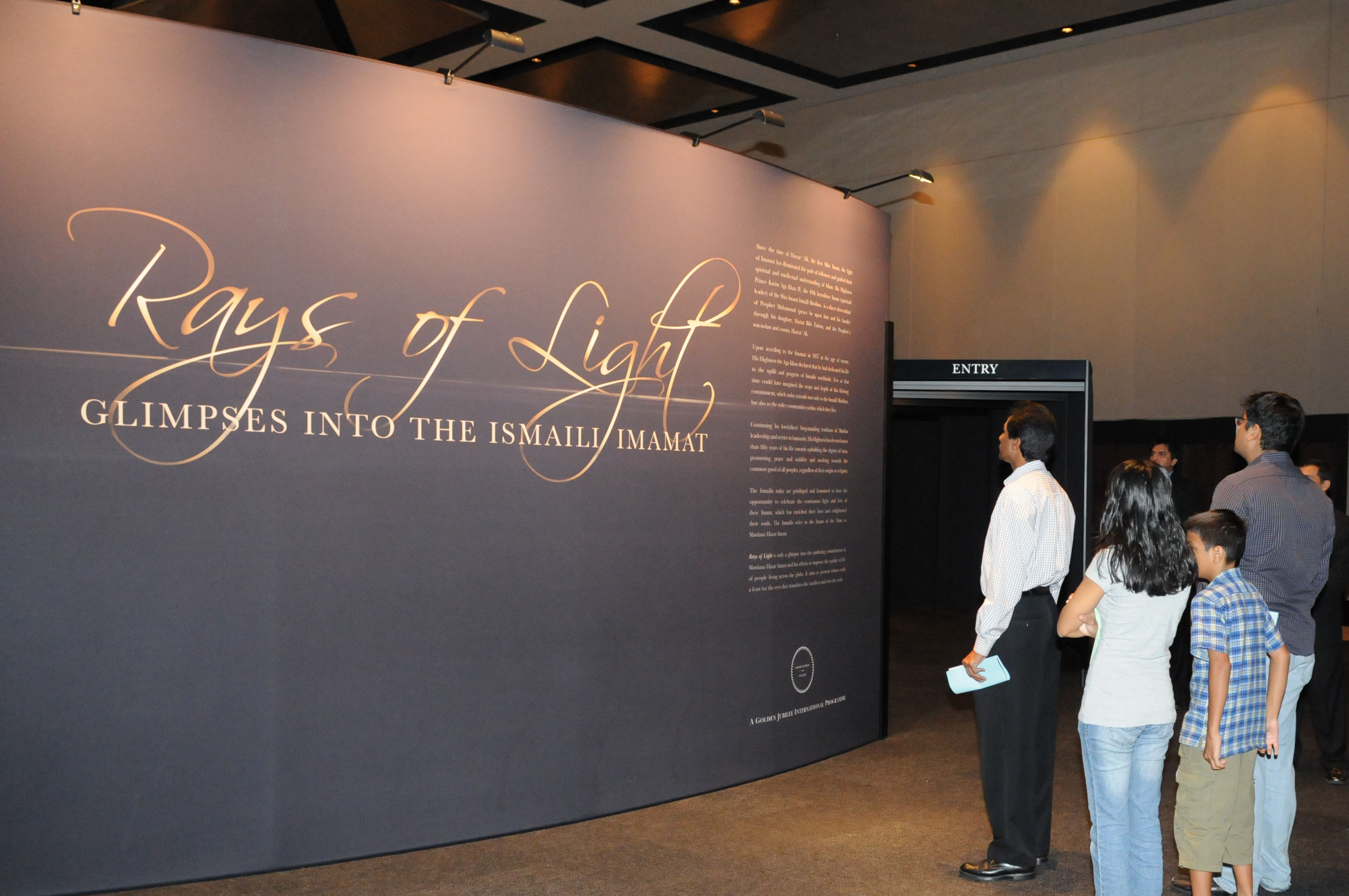 Members of the Jamat wait their turn at the entrance of the circular Rays of Light exhibit. Photo: Courtesy of the Ismaili Council for the USA