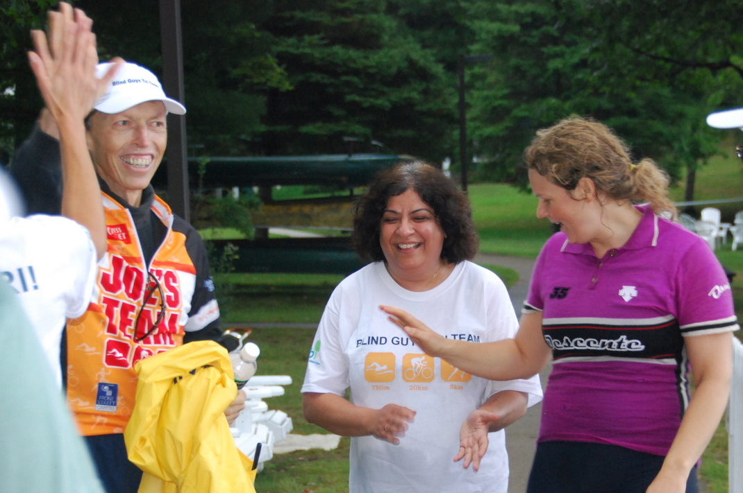 Rozina Issani celebrates with fellow members of the Blind Guys Tri Team. Photo: Courtesy of Rozina Issani