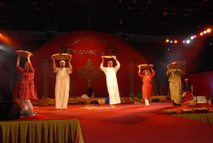 Young adults from the UAE Jamat performing in the Cultural Walk depict traditional Eid celebrations in Syria. Photo: Ally`s studio on wheels 