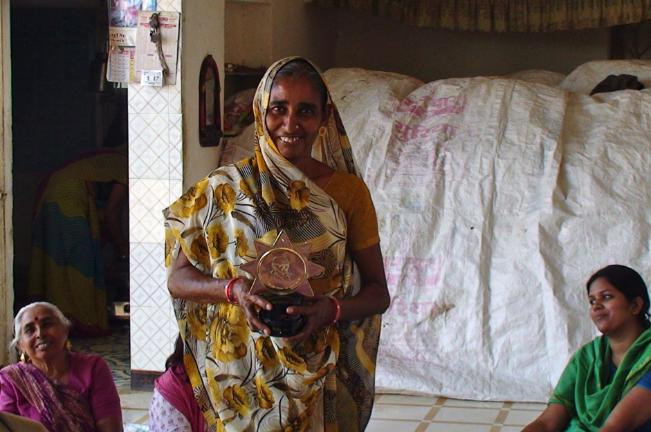 The sur-panch of Amrapur shows off an award for sanitation bestowed upon the village by the government. Photo: Prashant Joshi