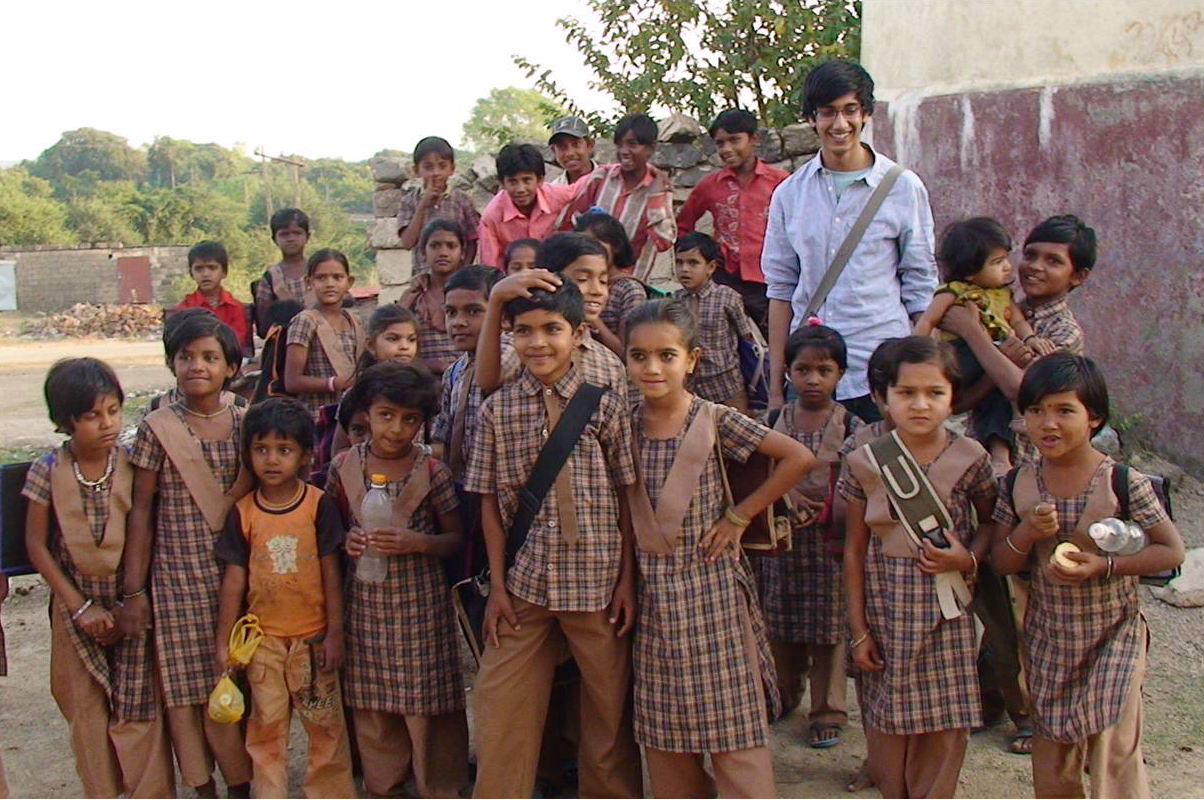 School children gather around Rahim Velji in Nani Khodiyar village. Photo: Prashant Joshi