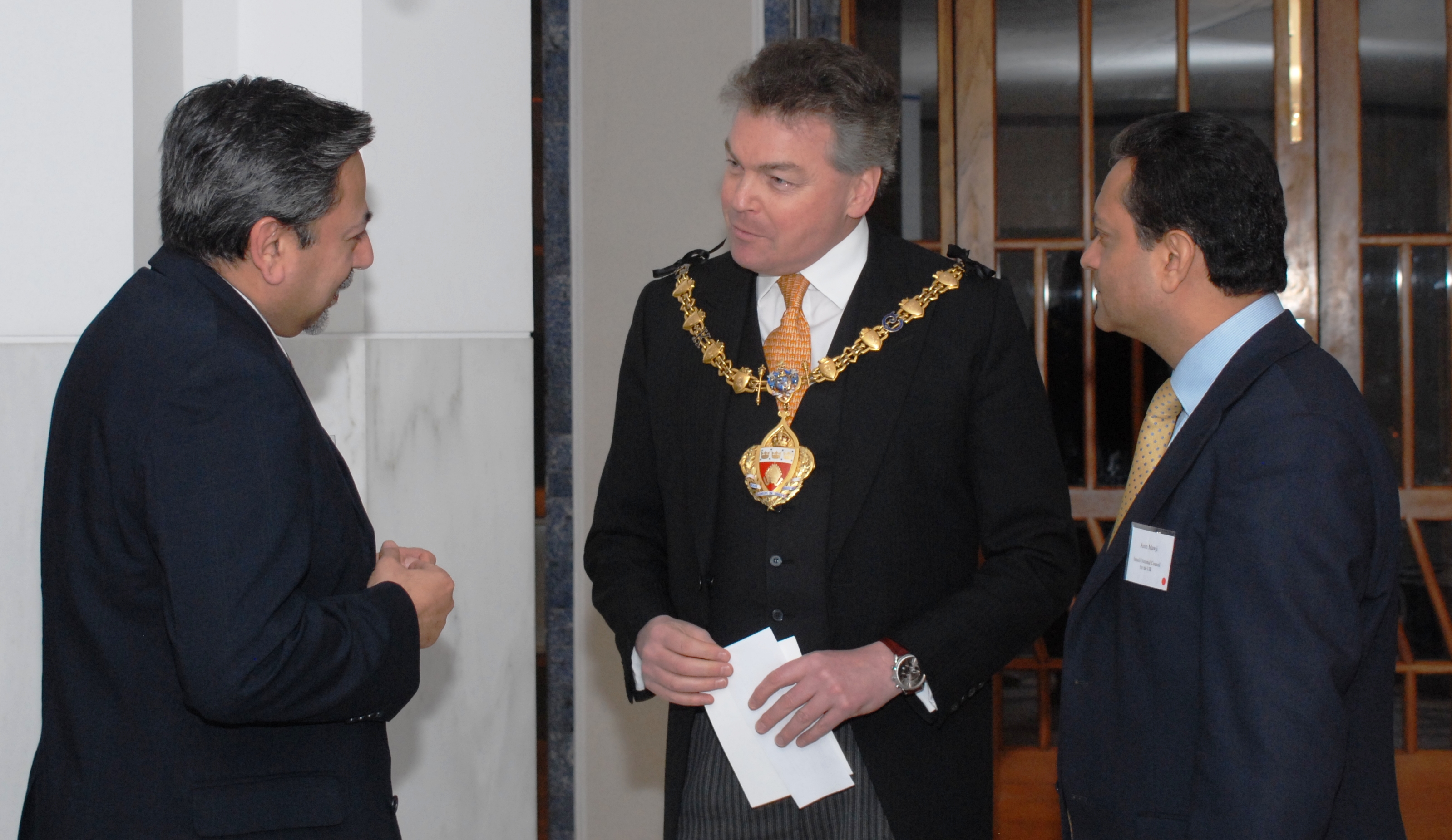 Mayor of the Royal Borough of Kensington and Chelsea, The Worshipful Timothy Coleridge, is welcomed to the Ismaili Centre, London by President Amin Mawji (R) and Vice-President Shiraz Kabani (L) of the Ismaili Council for the United Kingdom. Photo: Courtesy of The Institute of Ismaili Studies