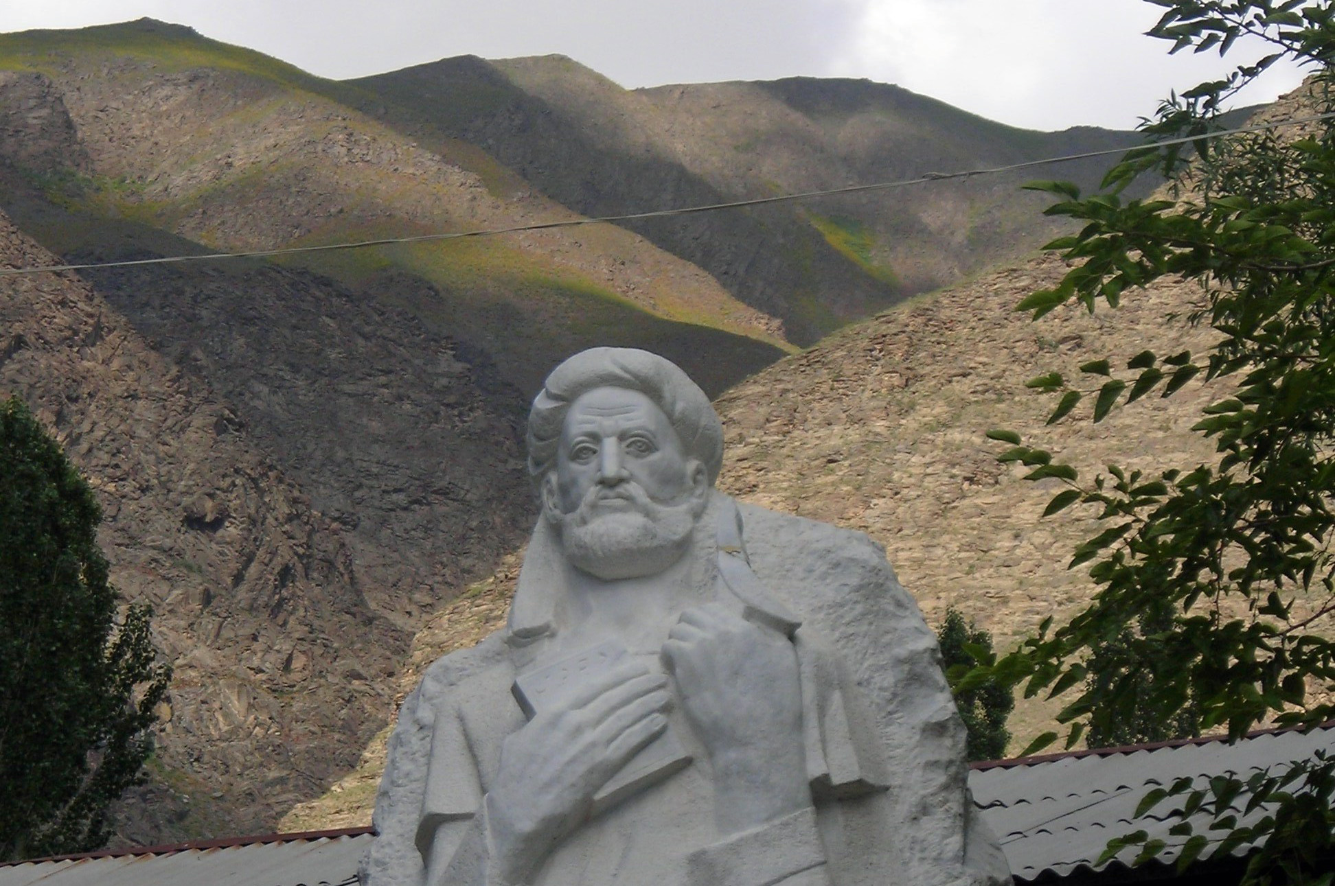 A statue of Nasir Khusraw with the Pamir Mountains rising behind him. Photo: Janet Southern