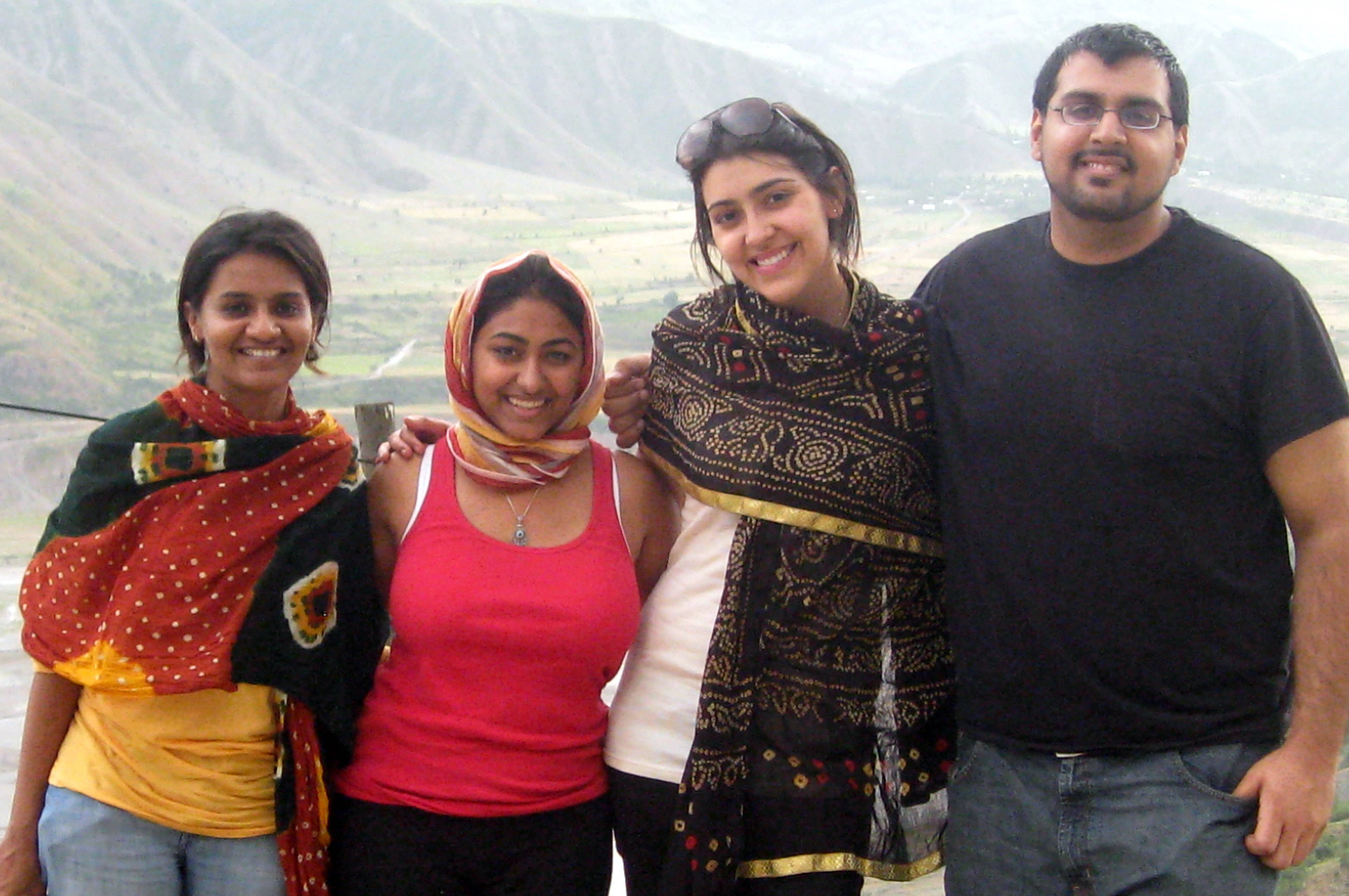 The four 2009 FOCUS Global Interns for Tajikistan pause for a photograph as they travel from Dushanbe to Khorog. (L to R: Nazia Gadhia, Safiyya Devraj, Janet Southern, and Samir Panjwani). Photo: Courtesy of Nazia Gadhia