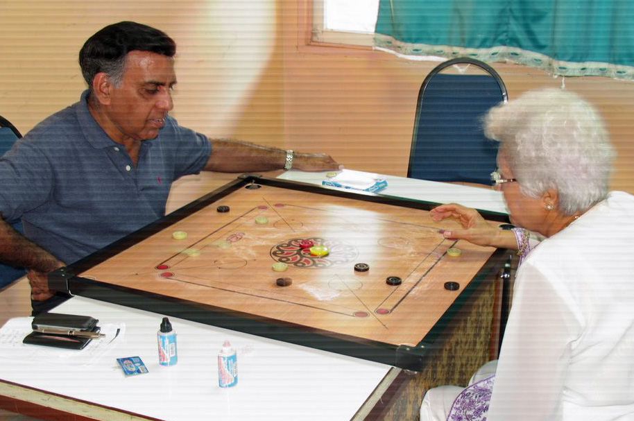 Seniors enjoying a game of carrom at the Far East Jamati Sports Day held in Penang. Photo: Pervaiz Machiwala