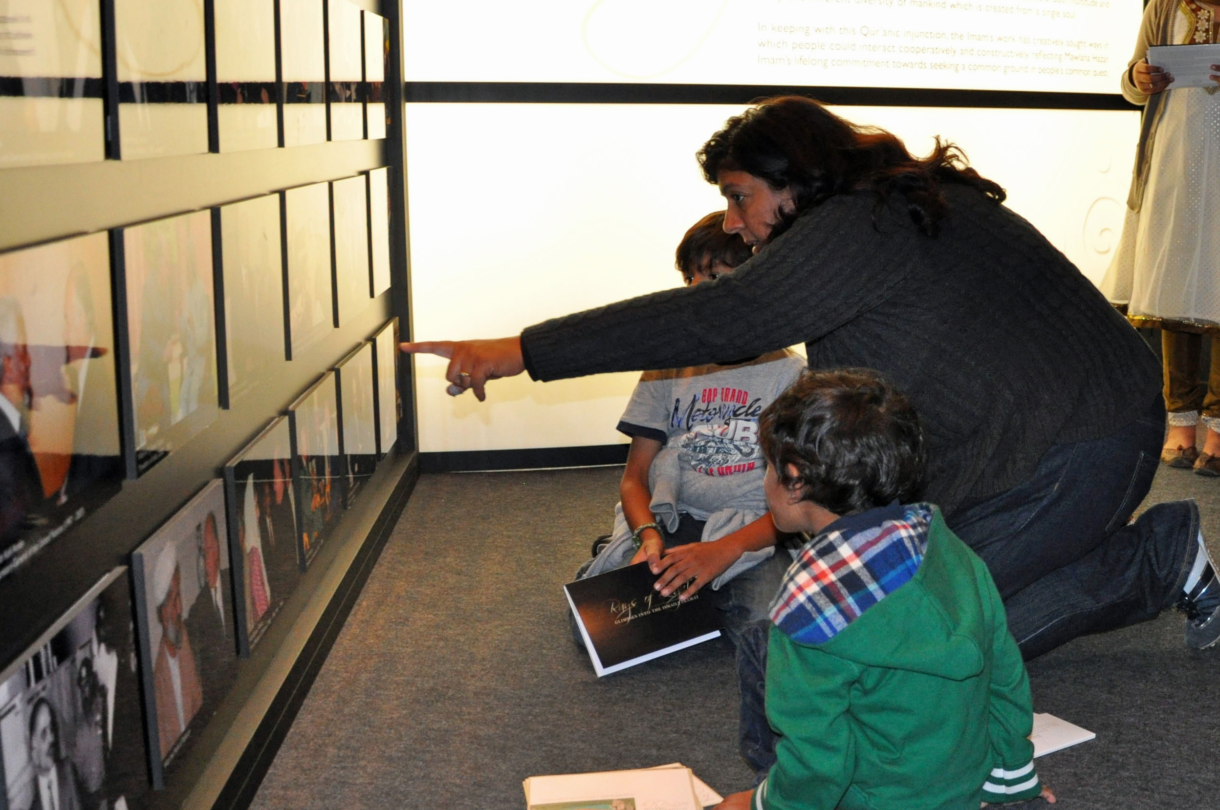 Children from Bait-ul Ilm learn about the work of the Ismaili Imamat at the RAYS OF LIGHT exhibition in London. Photo: Nina Hirji Kheraj