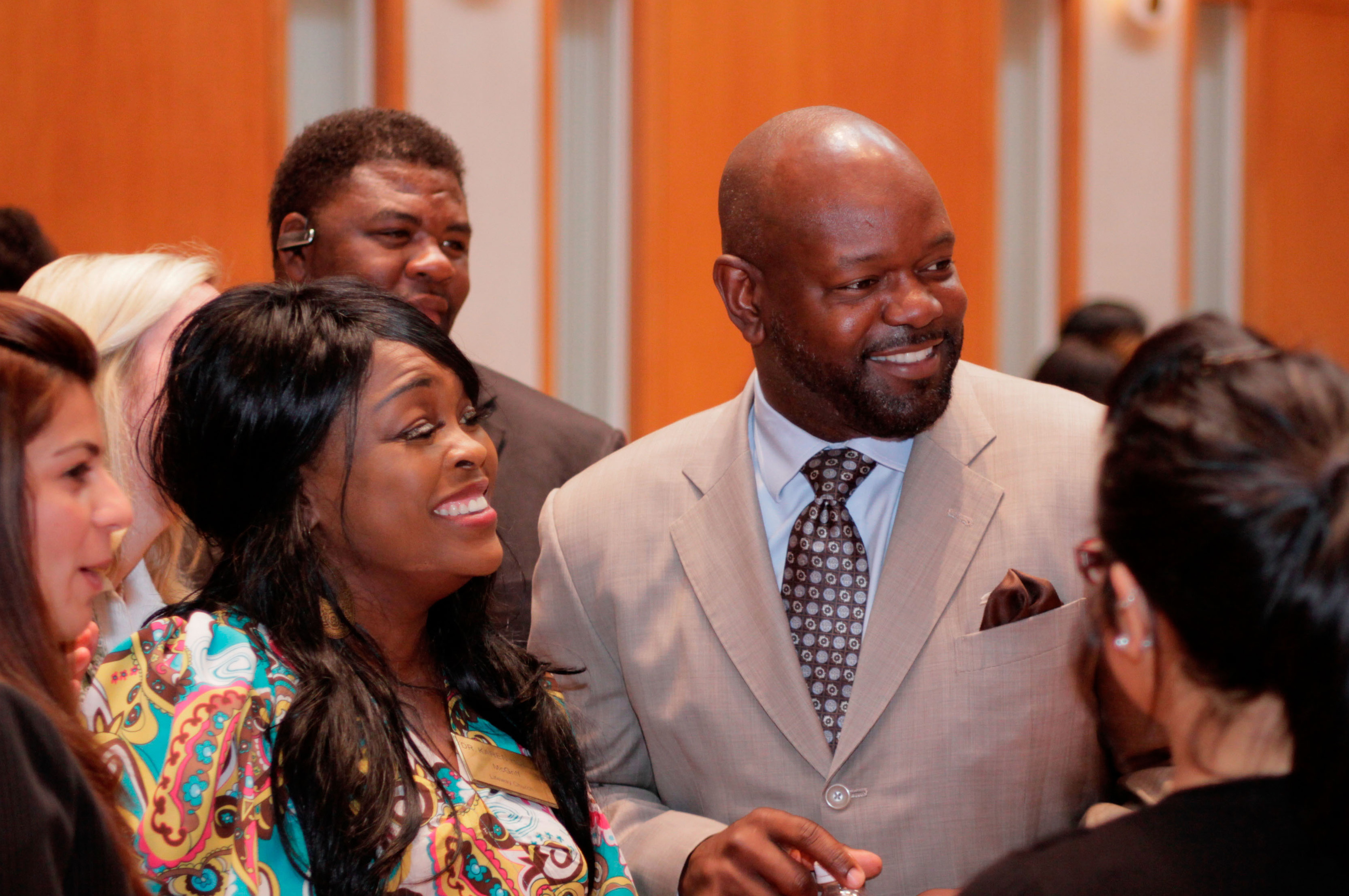 Former Dallas Cowboys football player Emmitt Smith chats with guests prior to the start of the Youth Summit. Photo: Bombay Photography