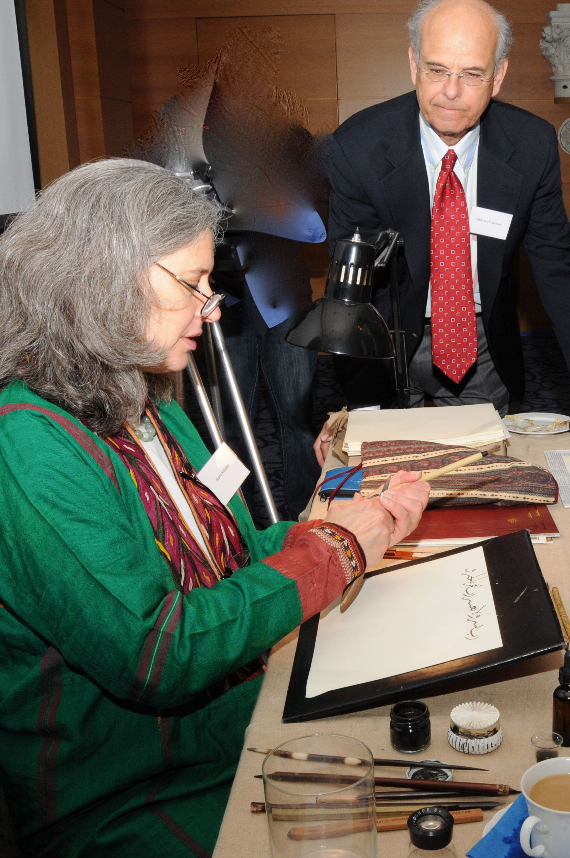 Calligrapher Elinor Aishah Holland conducts a live calligraphy demonstration at the Calligraphy Outreach Reception held on 11 November 2010 at the Michael C. Carlos Museum. Photo: Ramzan Qasamali