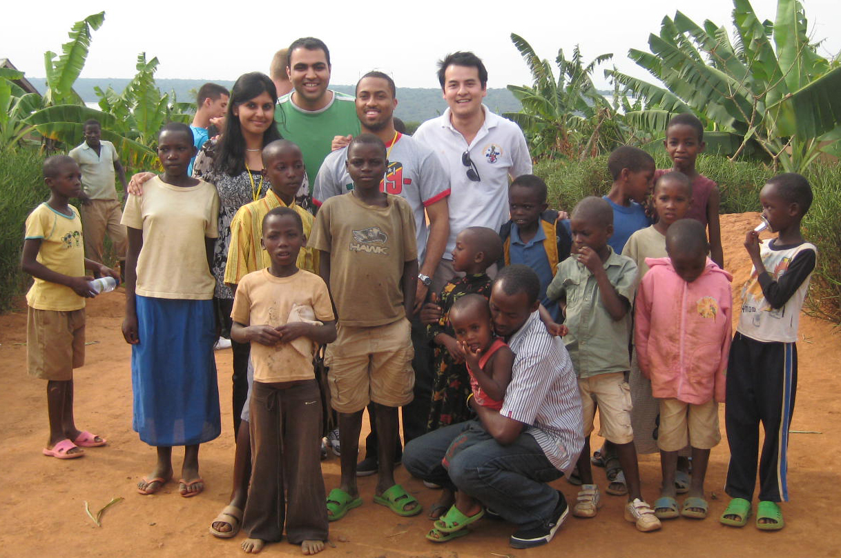 Children gather with some of the Nkabom participants at the reconciliation village. Photo: Courtesy of Naveed Somani