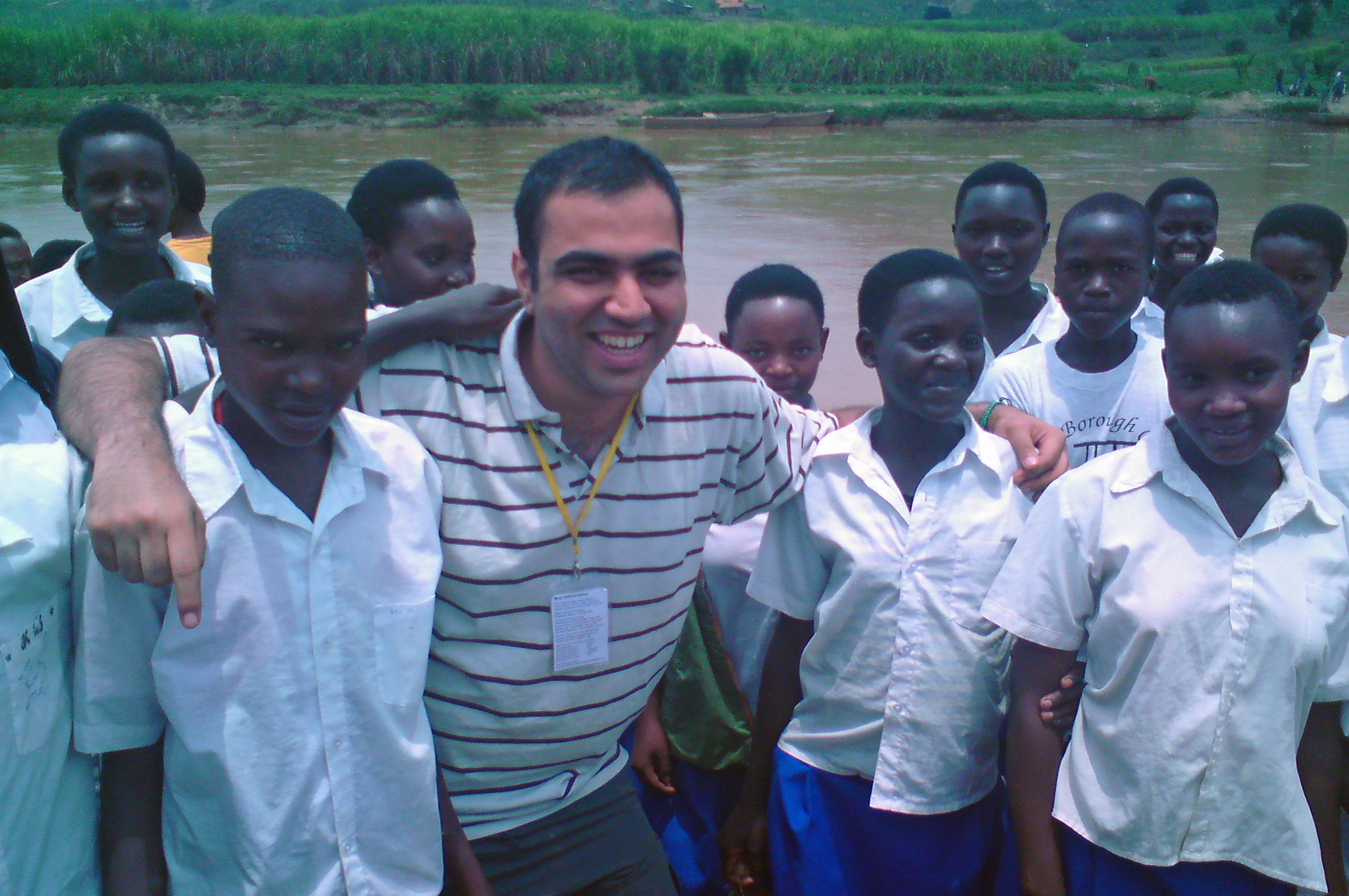 Naveed Somani with local school children at an environmental conservation project in Rwanda. Photo: Courtesy of Naveed Somani