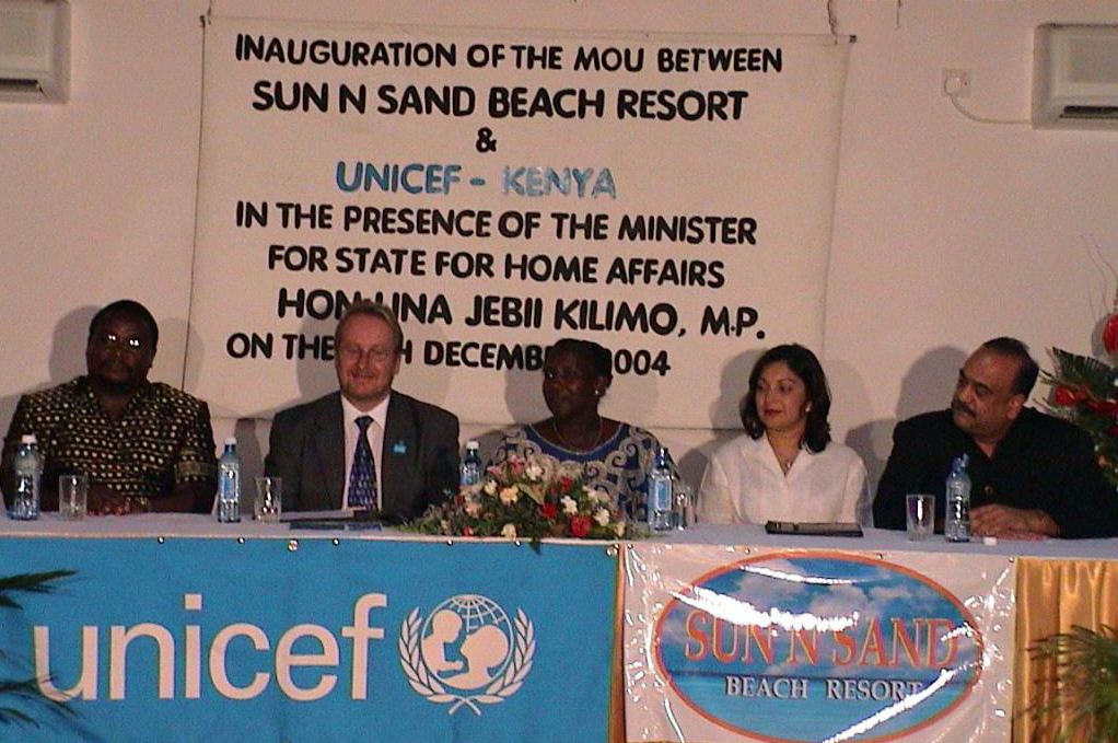 Shahinoor M. Visram and Mahmud Visram participate in the signing of a Memorandum of Understanding for the Protection of Children between the Sun n Sand Beach Resort and UNICEF in December 2004. Photo: Courtesy of Shahinoor M. Visram