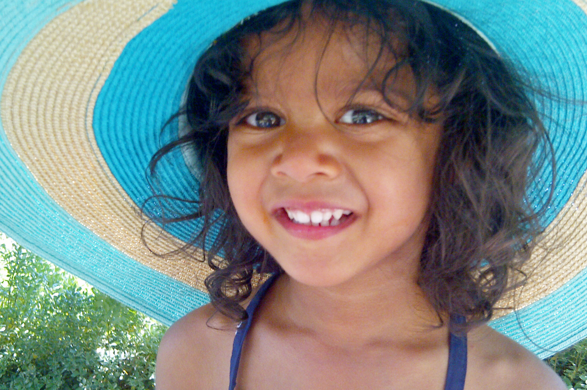 Zaleeya Dhalla find refuge from the hot sun under a stylish hat. Photo: Zeena Dhalla