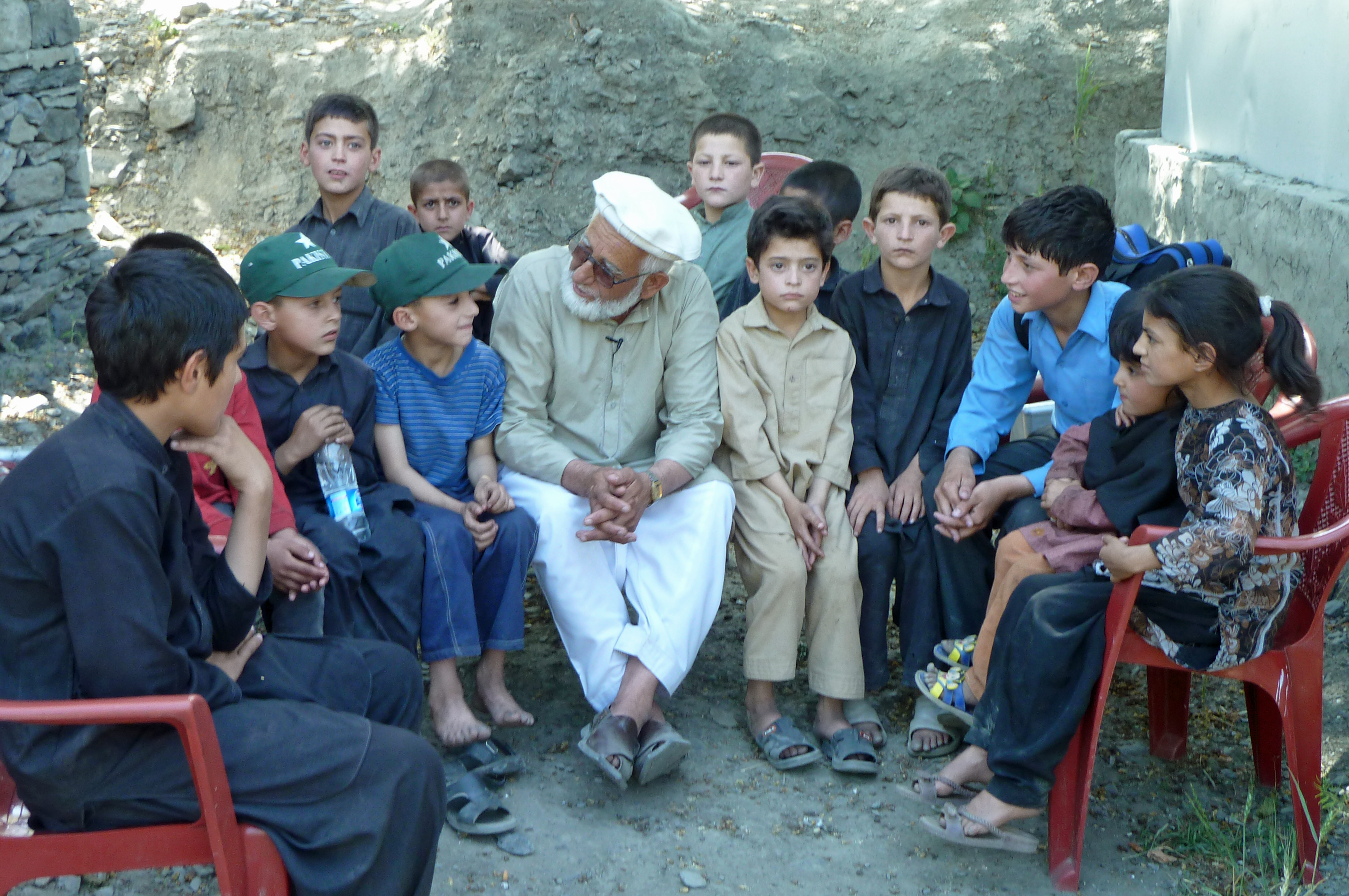 Rehmat Ghafoor Baig is seen with Faizan Arfeen along with other village children, some of whom were traumatised by the floods. Photo: Courtesy of the Ismaili Council for Pakistan