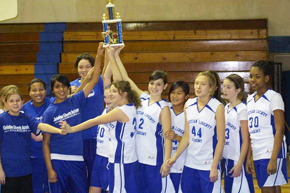 Captain of the girls basketball team, Inaara Tajuddin celebrates with teammates after winning first place at a school tournament. Photo: Shaheen Tajuddin