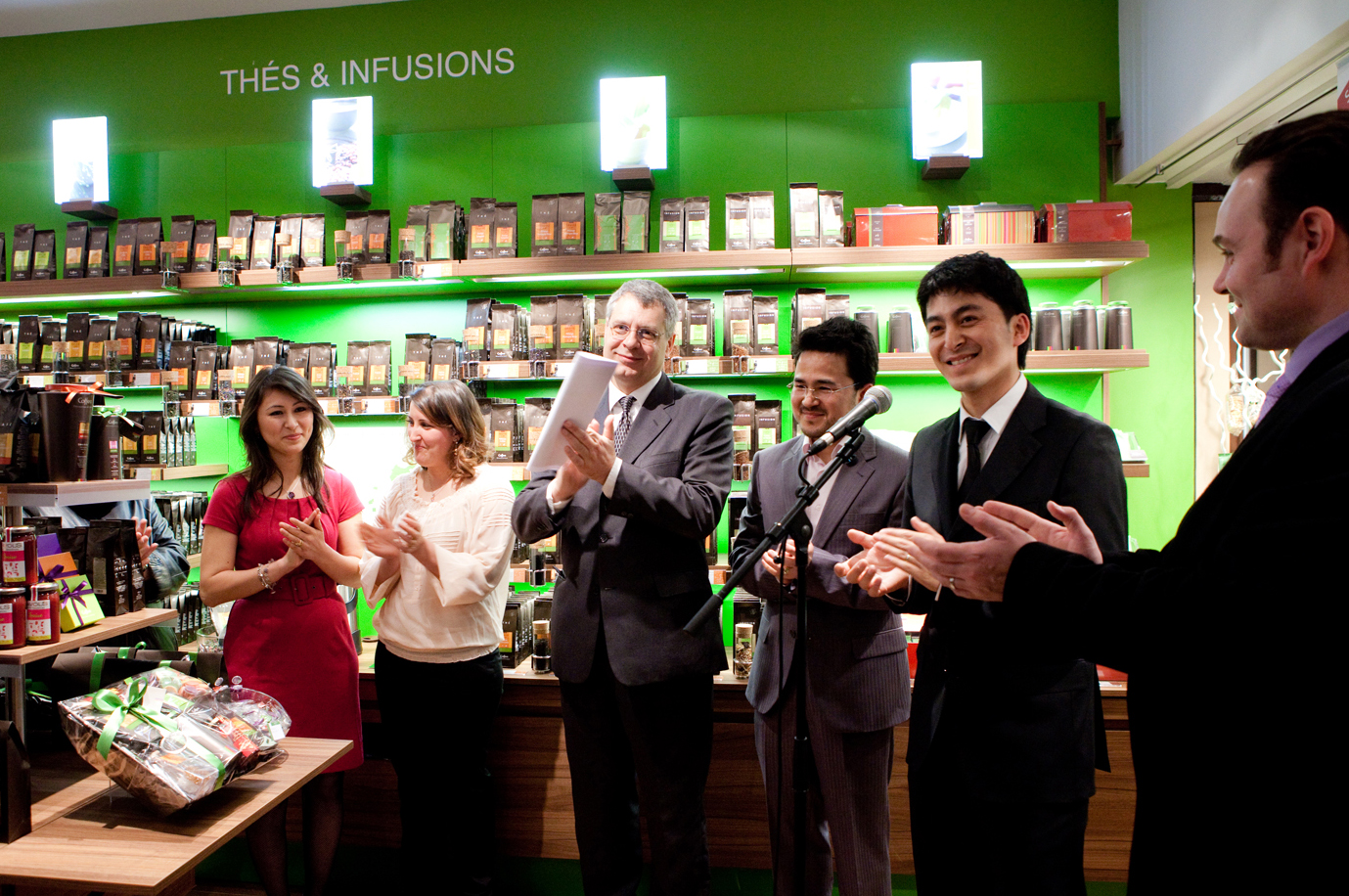 The Mayor of Argenteuil, Philippe Doucet, and the Deputy Mayor take part in the opening of a new business by two Ismaili families, who received advice and support through a programme organised by the Aga Khan Economic Planning Board for France. Photo: Courtesy of the Ismaili Council for France