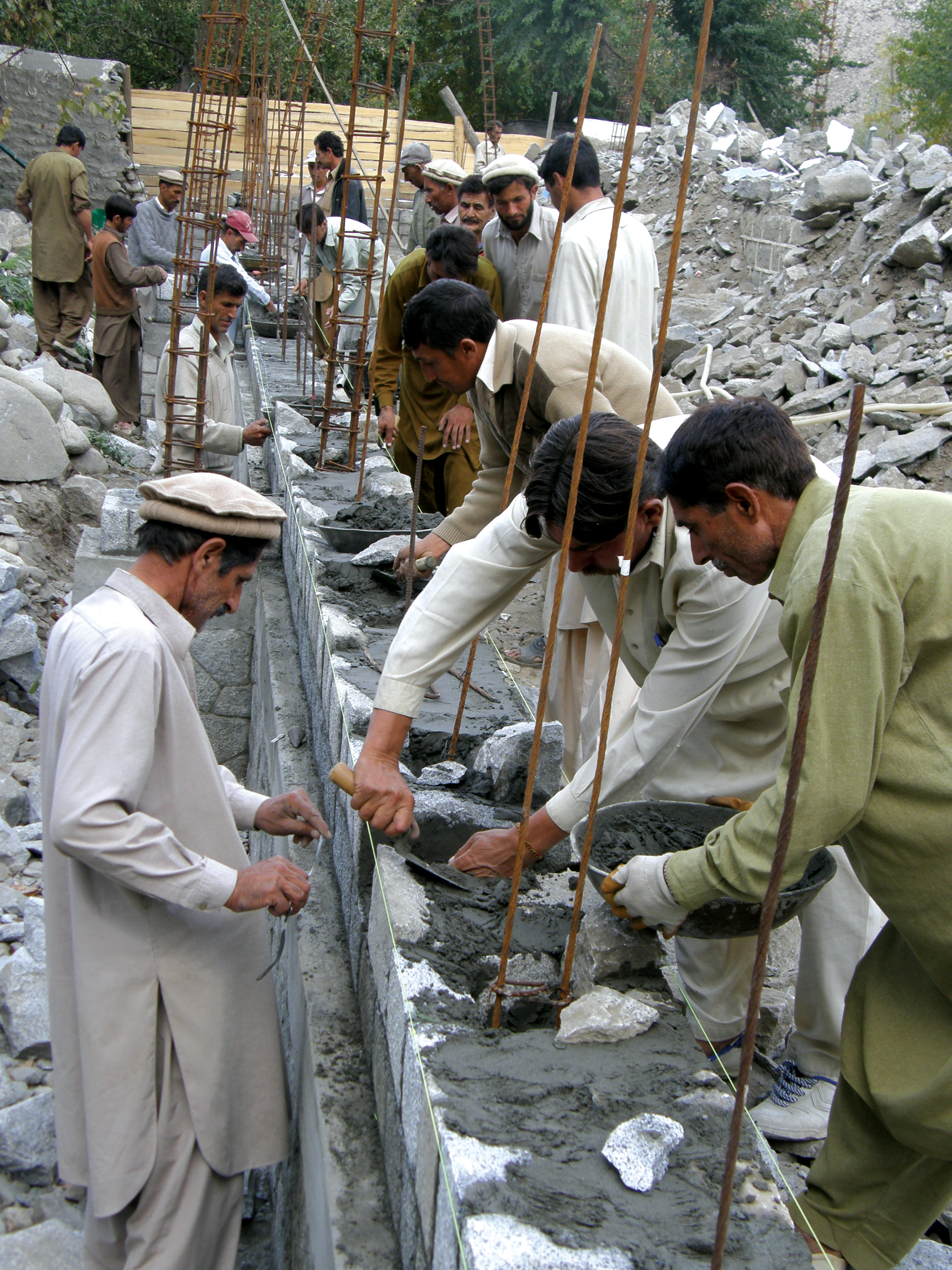 Members of the Jamat in Northern Pakistan uphold a long tradition of taking part in the construction of a new Jamatkhana. Photo: Courtesy of AKPBS, Pakistan