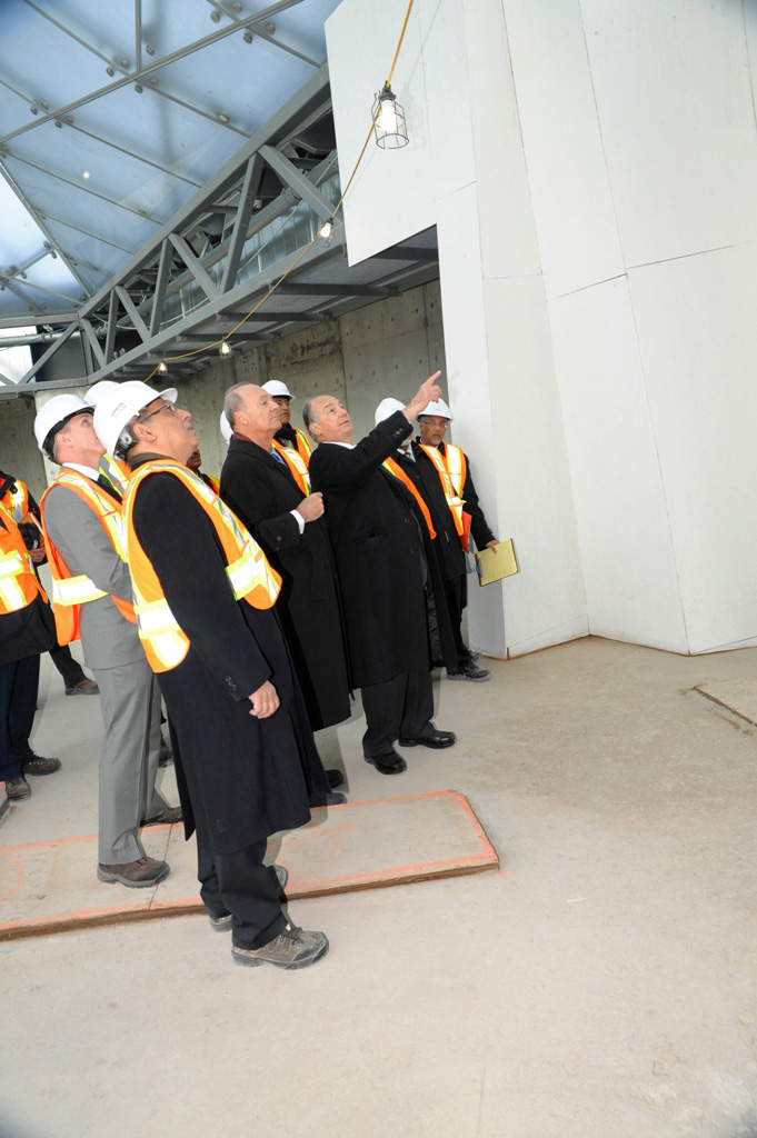 Mawlana Hazar Imam and Prince Amyn in the prayer hall of the Ismaili Centre, Toronto, discussing design details of the mihrab. Photo: Imara Wynford Drive / Moez Visram