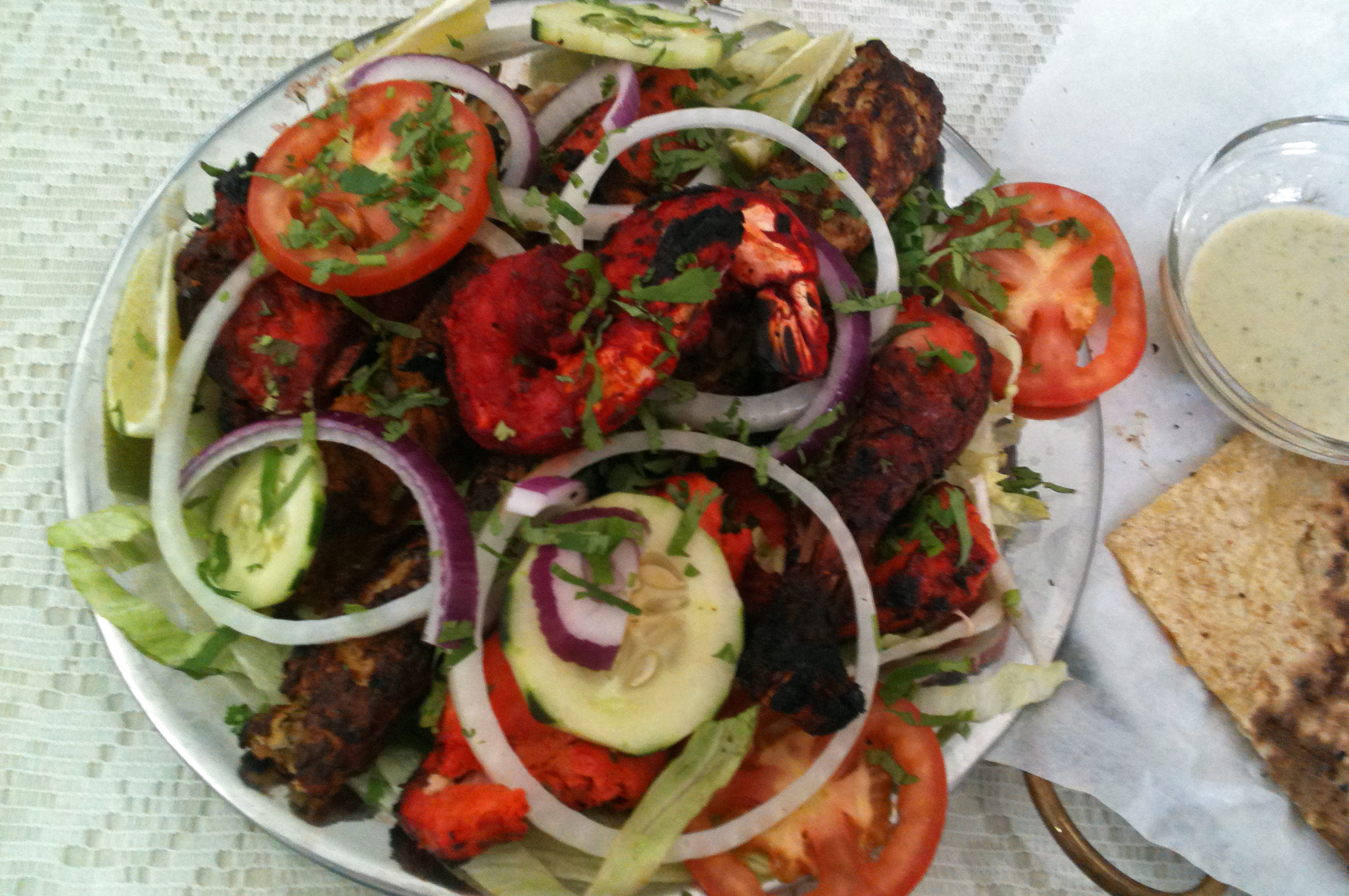 Tandoori chicken and salad. Photo: Courtesy of Karima Kurji