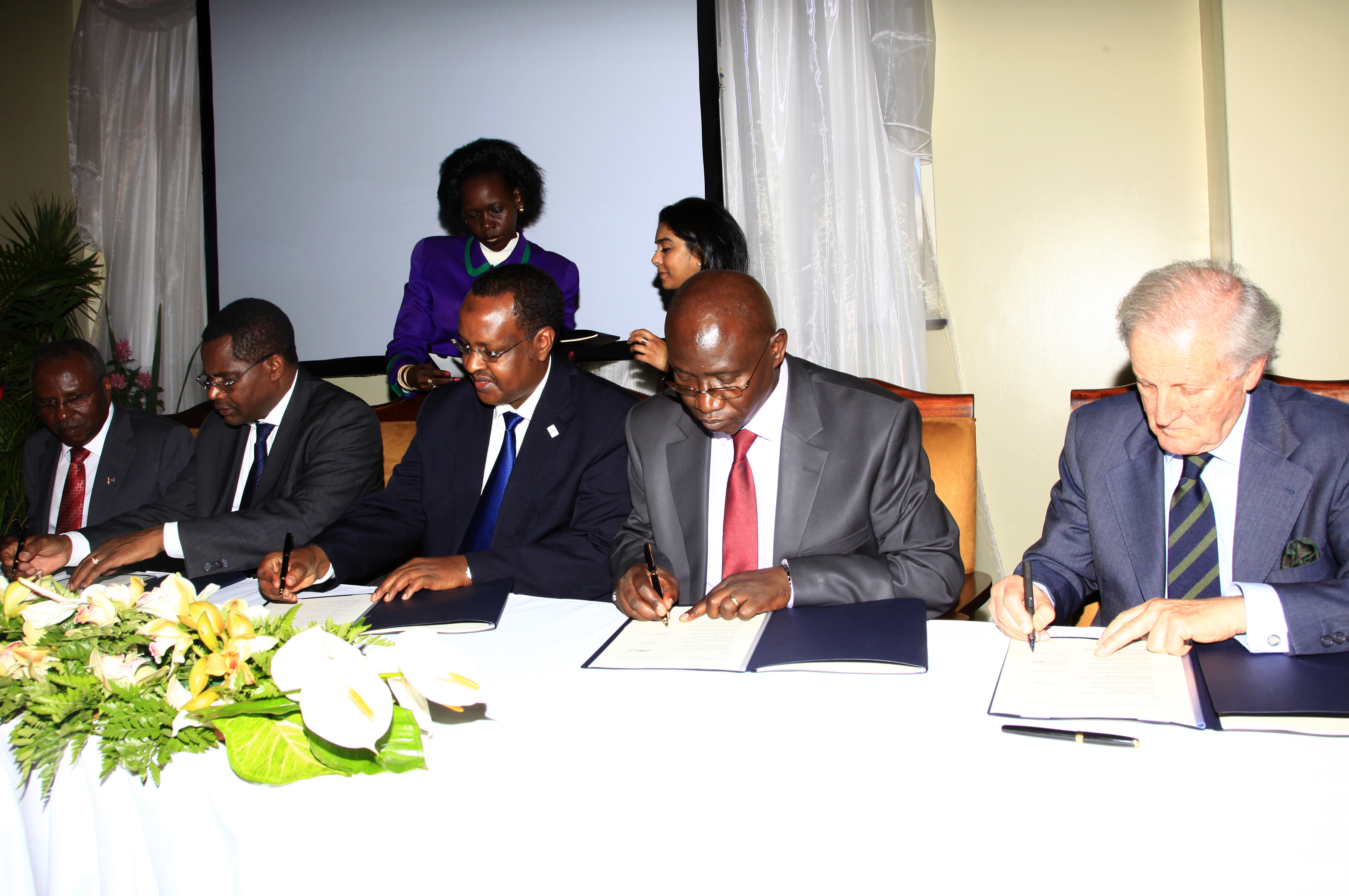 Signing the agreement (from left):  Professor Karega Mutahi, Dr Jacob Ole Miaron, Dr Idle Farah, P.T. Odongo, Luis Monreal. Photo: Samwell Nyakondo