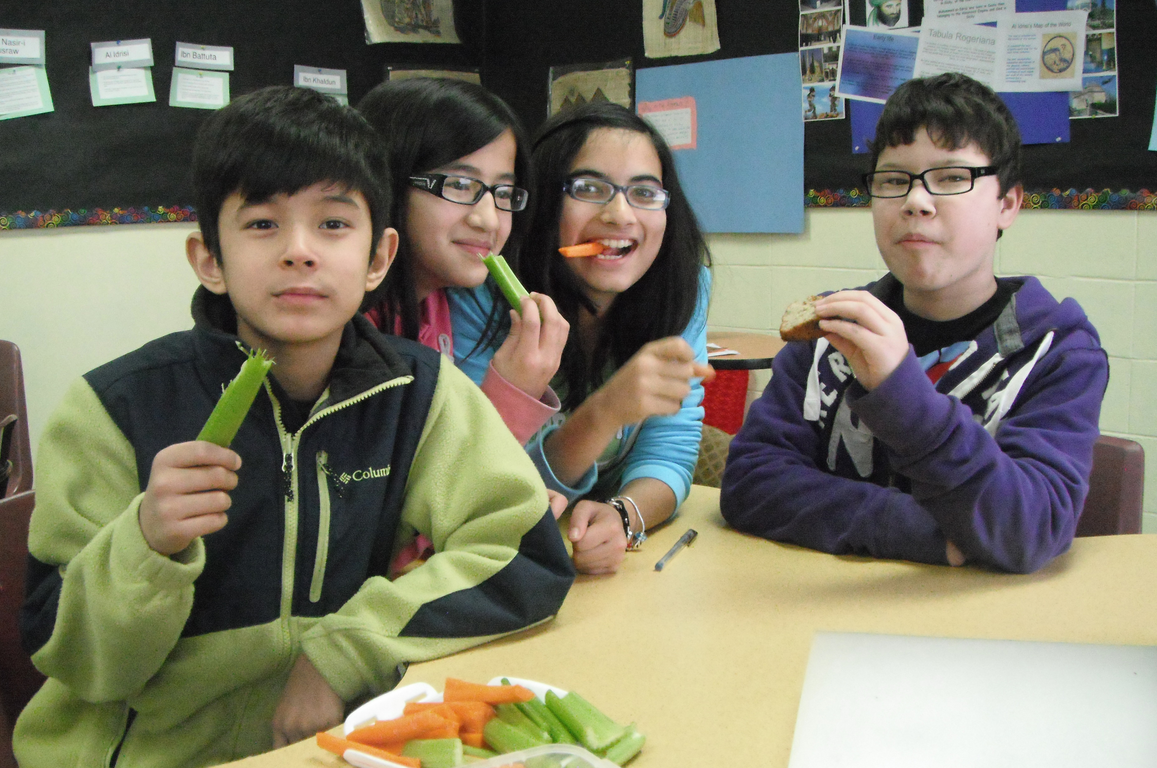 Children at Bait-ul Ilm snack on a healthy plate of vegetables. Photo: Shirzad Chunara